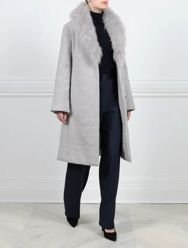 The Tessa Wool Puffer Coat with Shearling Collar sold by Pologeorgis