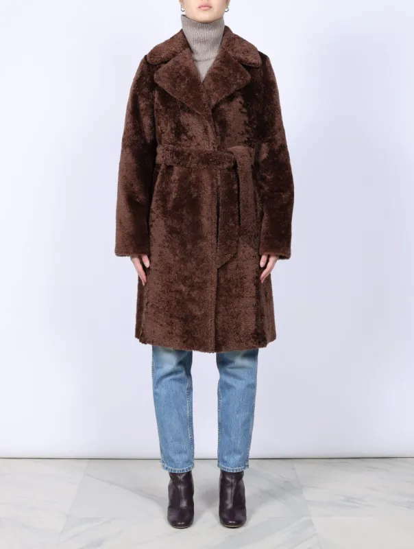 The Constance Shearling Wrap Coat sold by Pologeorgis