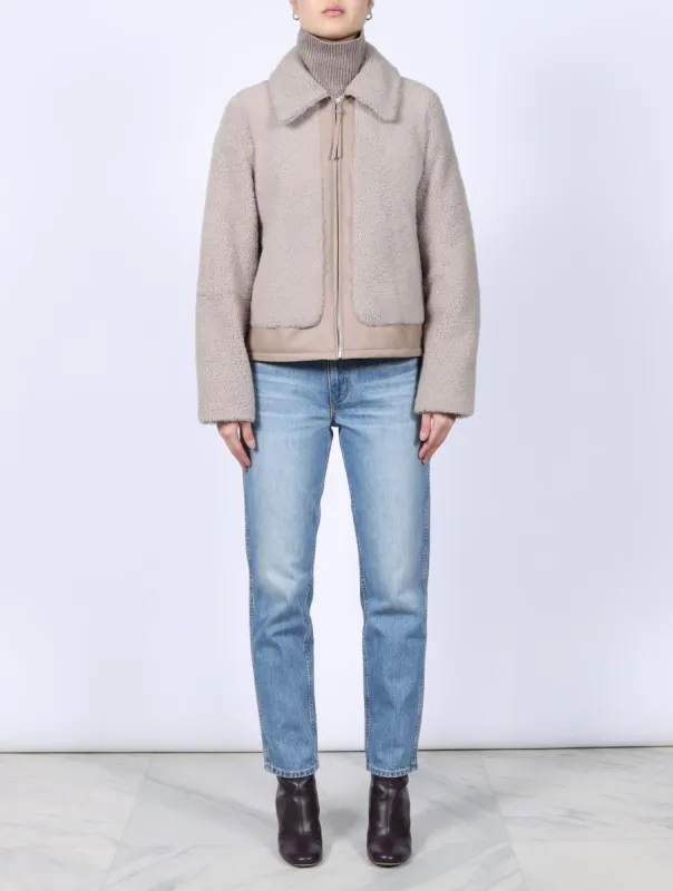 The Pippa Curly Shearling Leather Trimmed Jacket sold by Pologeorgis