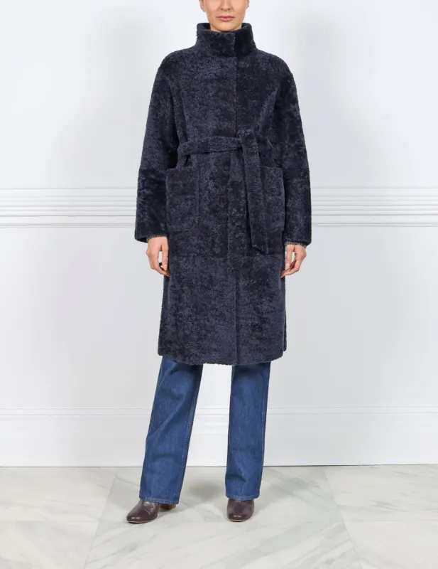 The Charli Shearling Wrap Coat sold by Pologeorgis