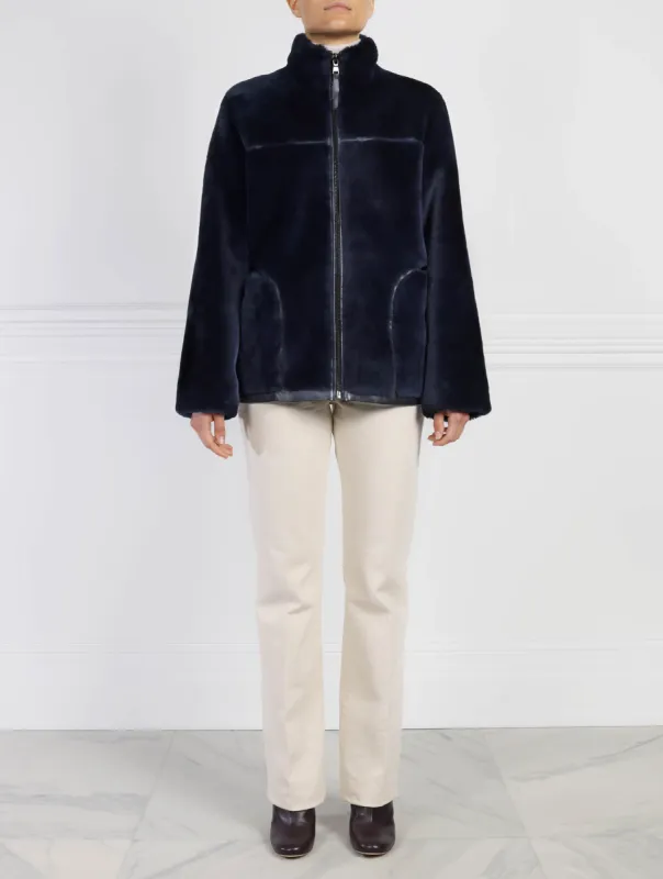 The Kacey Merino Shearling Zip Jacket sold by Pologeorgis