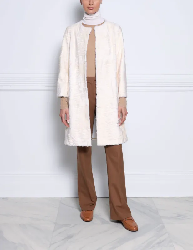 The Linden Swakara Lamb Coat in White sold by Pologeorgis