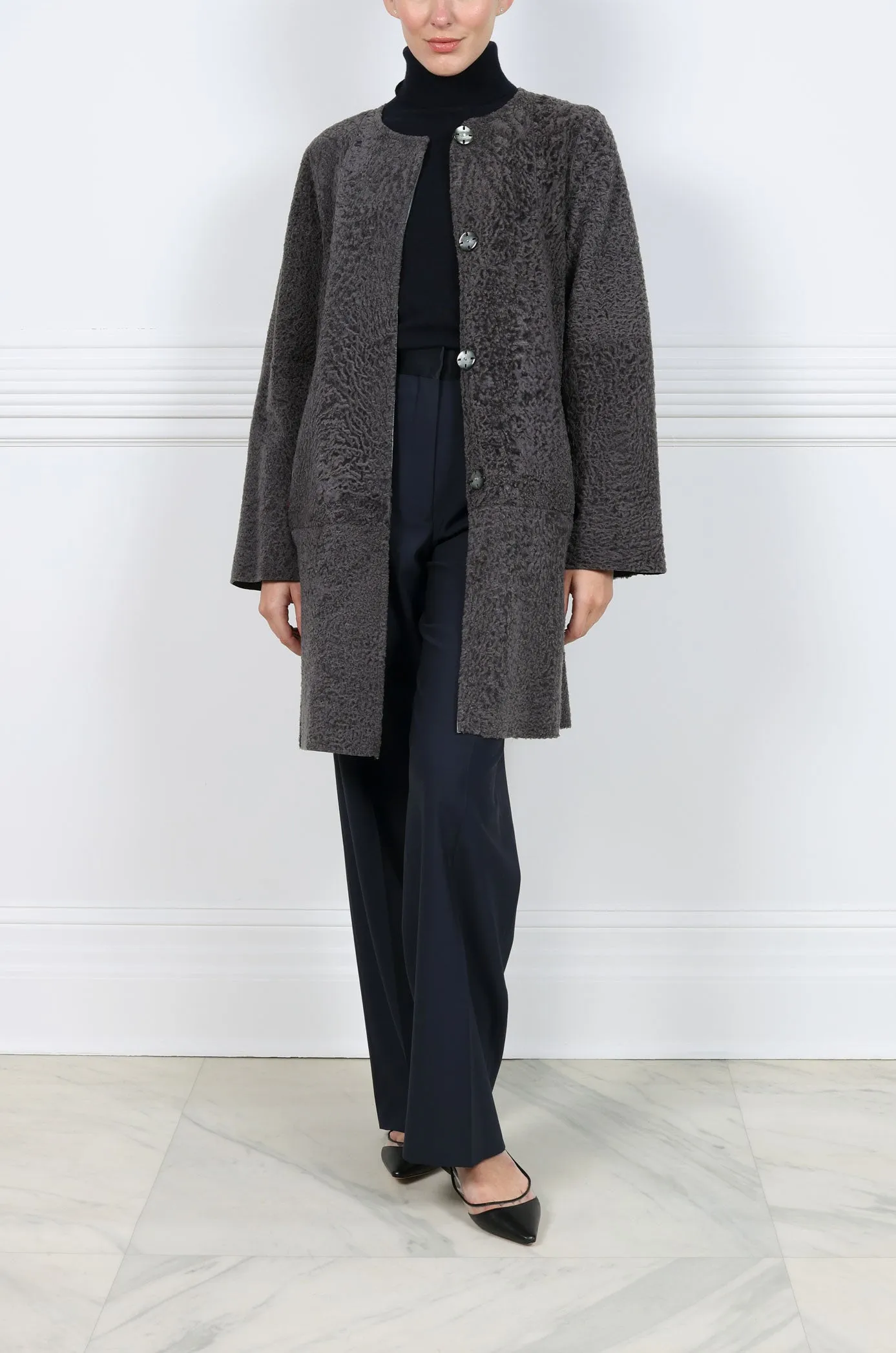 The Olivia Metallic Shearling Coat sold by Pologeorgis