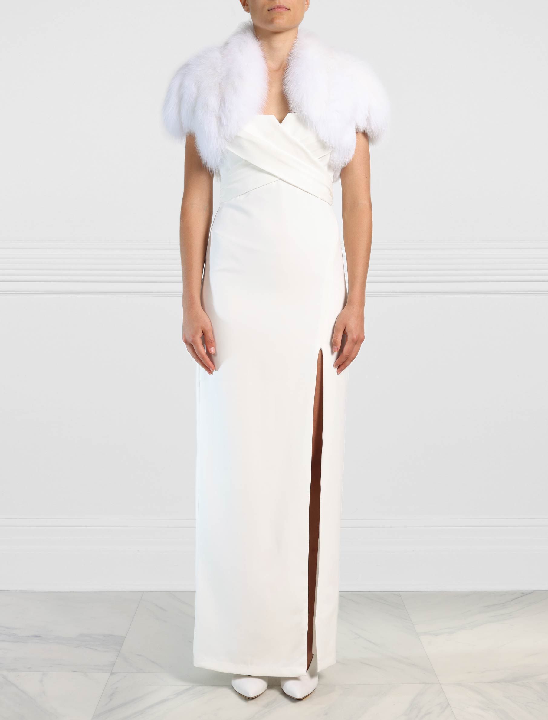 The Drew Fox Fur Shrug in White sold by Pologeorgis