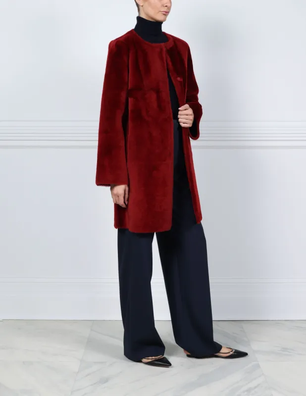 The Tempest Reversible Shearling Coat in Merlot sold by Pologeorgis