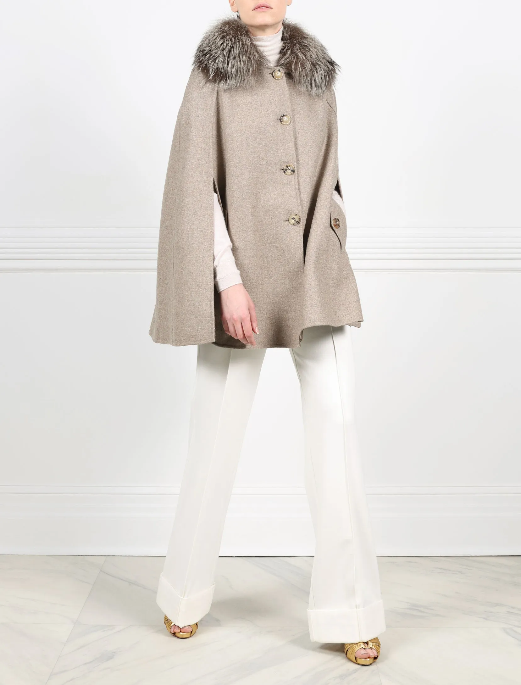 The Charleston Woven Cape with Fur Collar sold by Pologeorgis