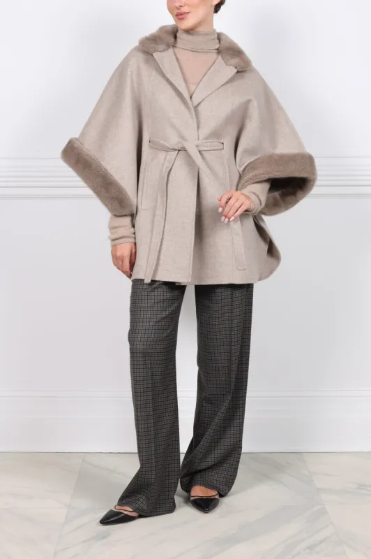 The Kai Double Face Cashmere Cape with Mink Trim sold by Pologeorgis
