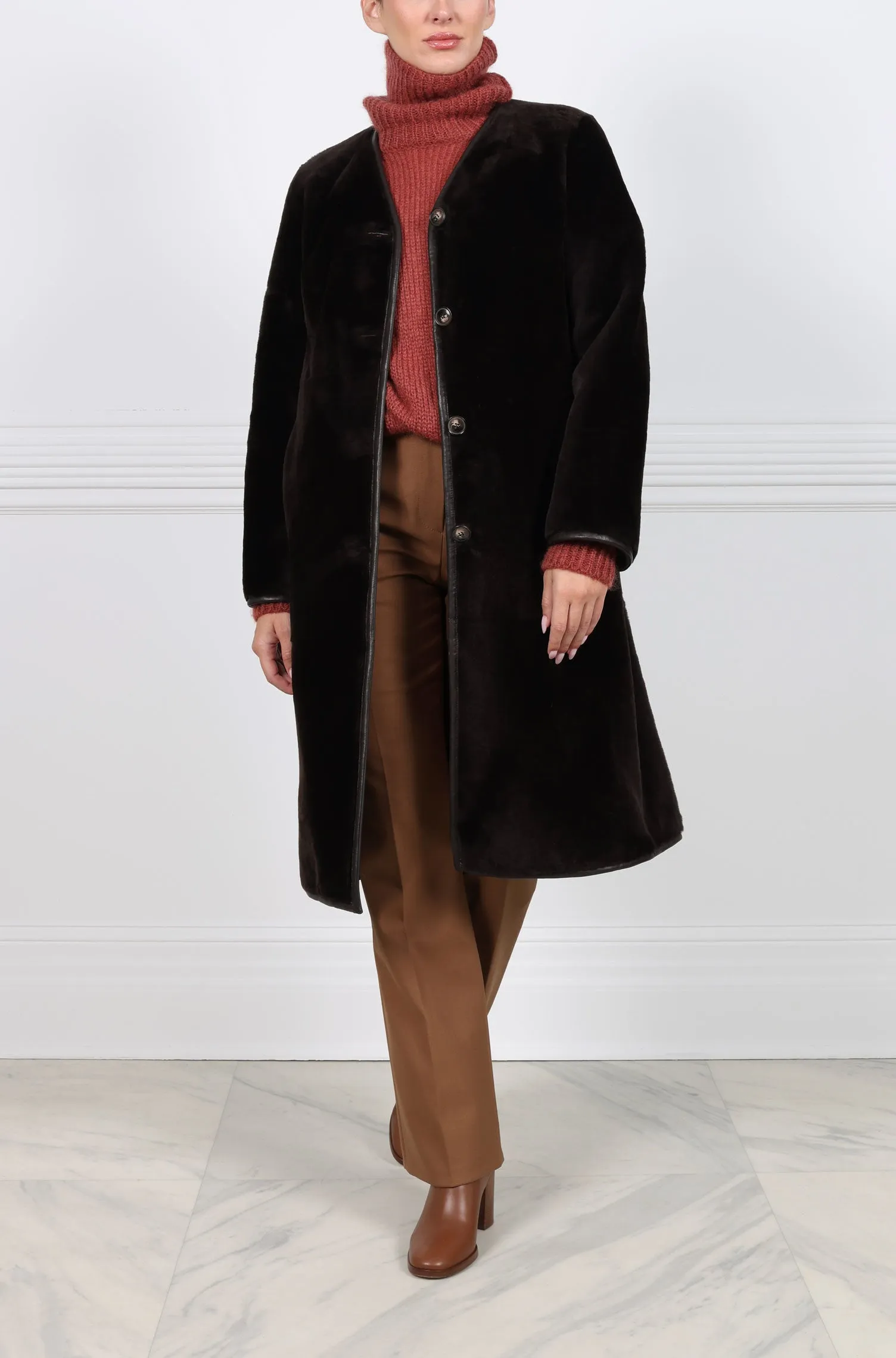 The Annie Reversible Merino Shearling Coat sold by Pologeorgis