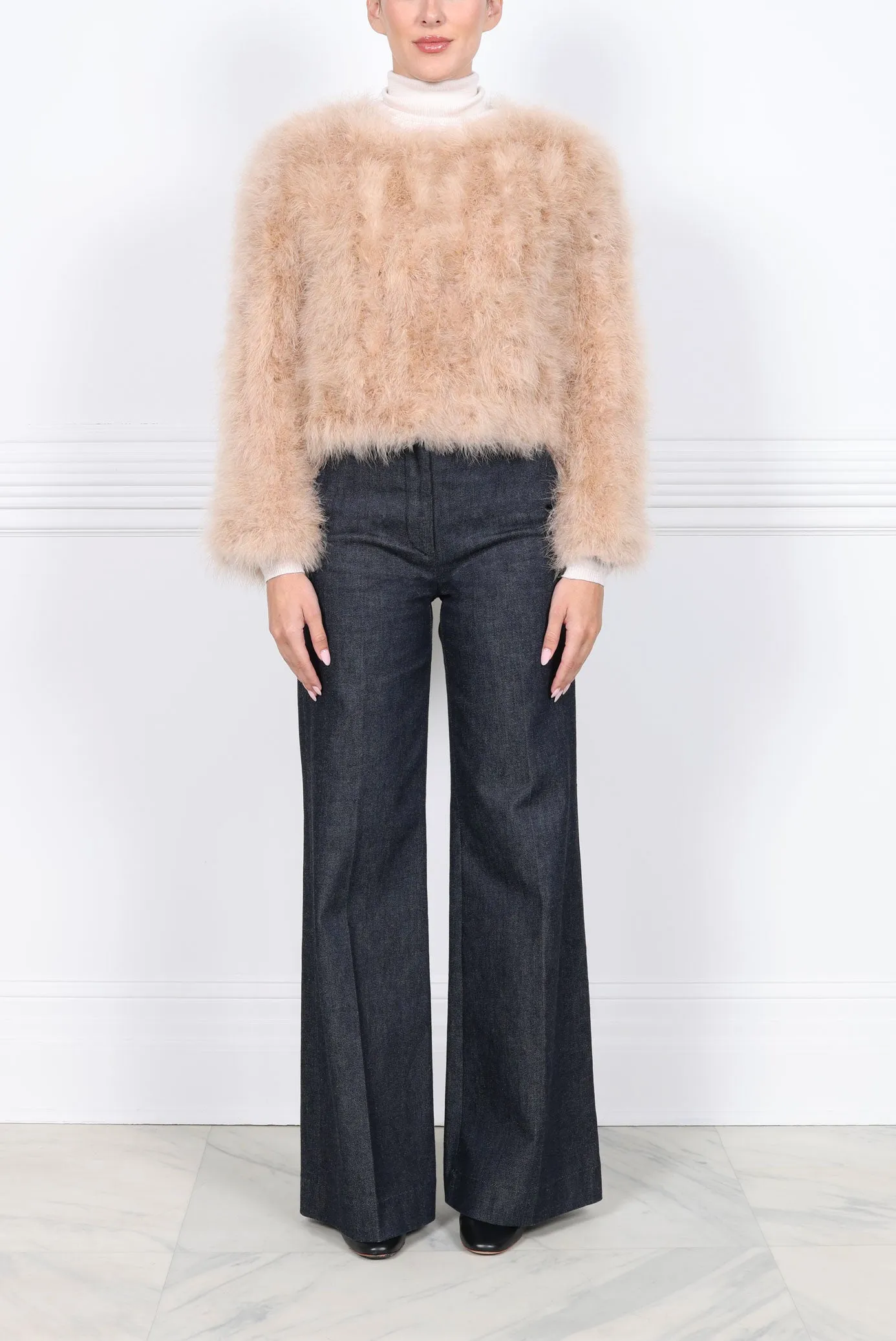 The Taylor Feather Jacket sold by Pologeorgis