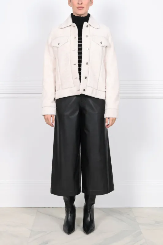 The Jennifer Shearling Denim Jacket sold by Pologeorgis