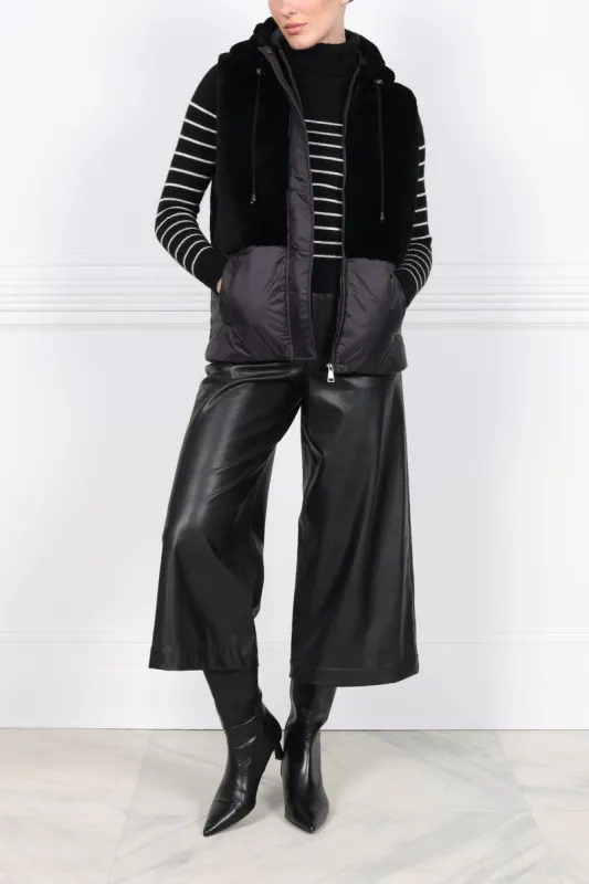 The BC Hooded Shearling Puffer Vest sold by Pologeorgis