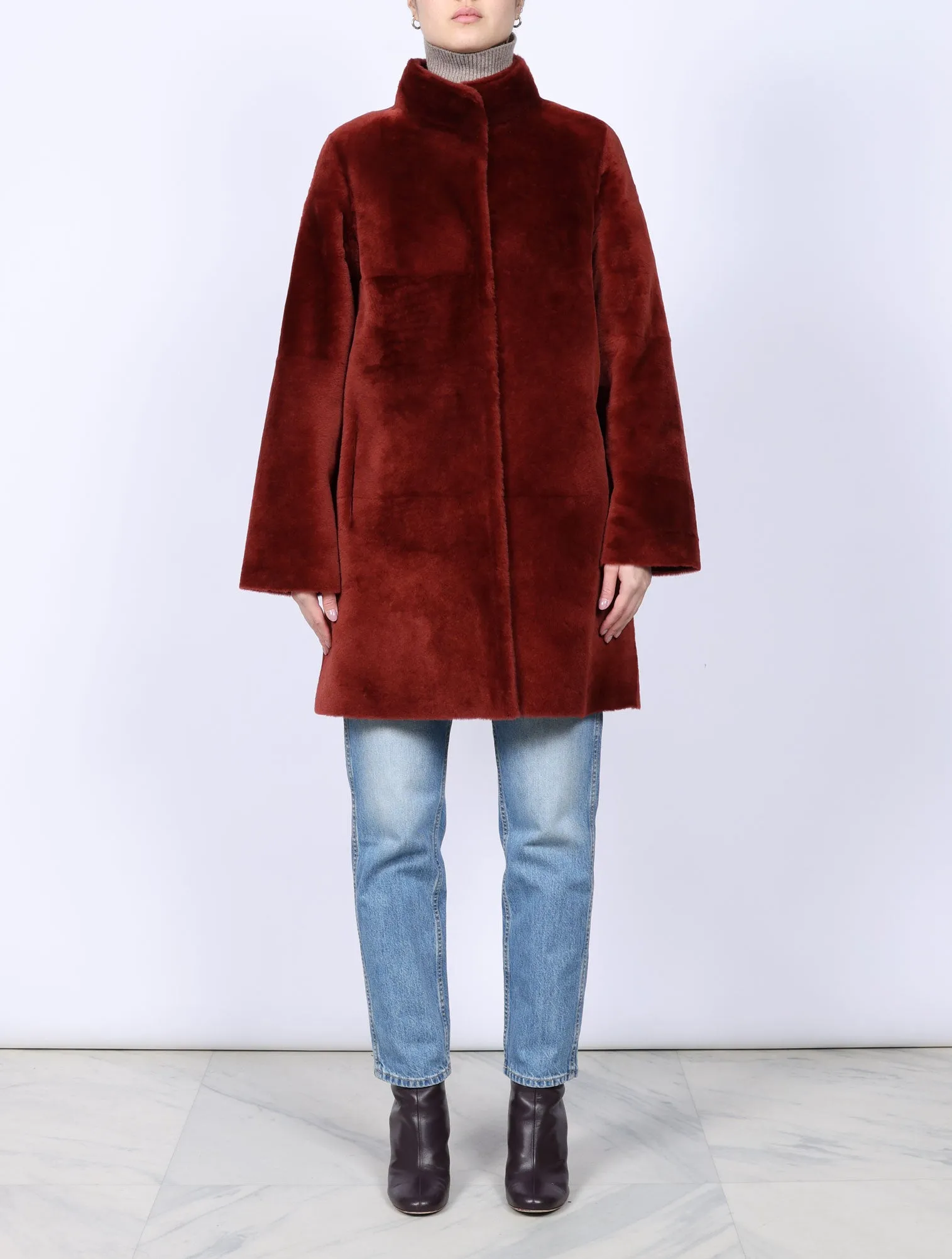 The Jenna Shearling Coat in Burgundy sold by Pologeorgis