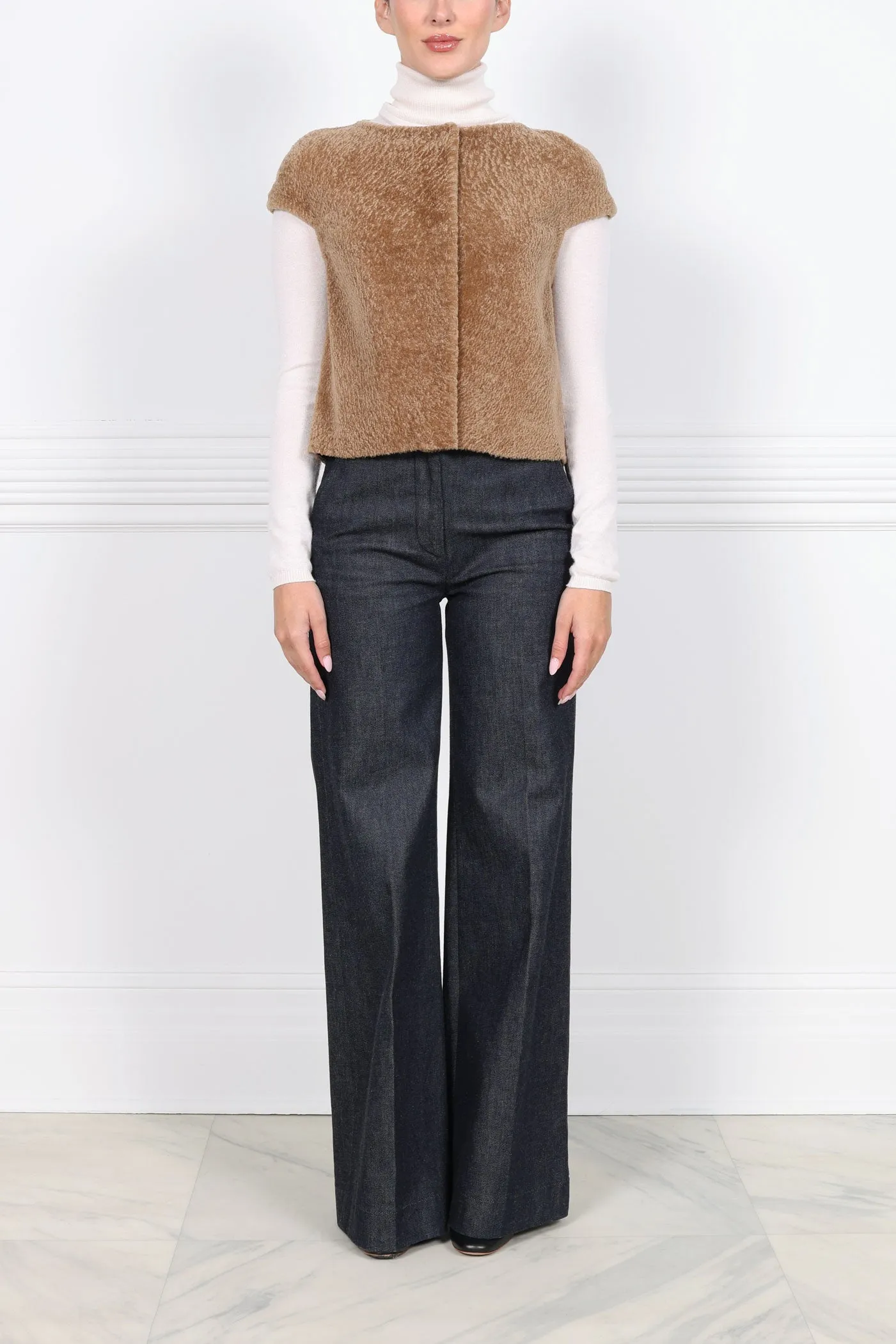 The Cap Sleeve Shearling Vest sold by Pologeorgis