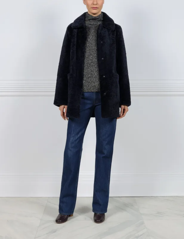 The  Stasia Curly Shearling Jacket sold by Pologeorgis