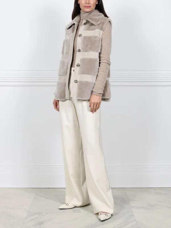 The  Lodge Shearling & Suede Vest sold by Pologeorgis