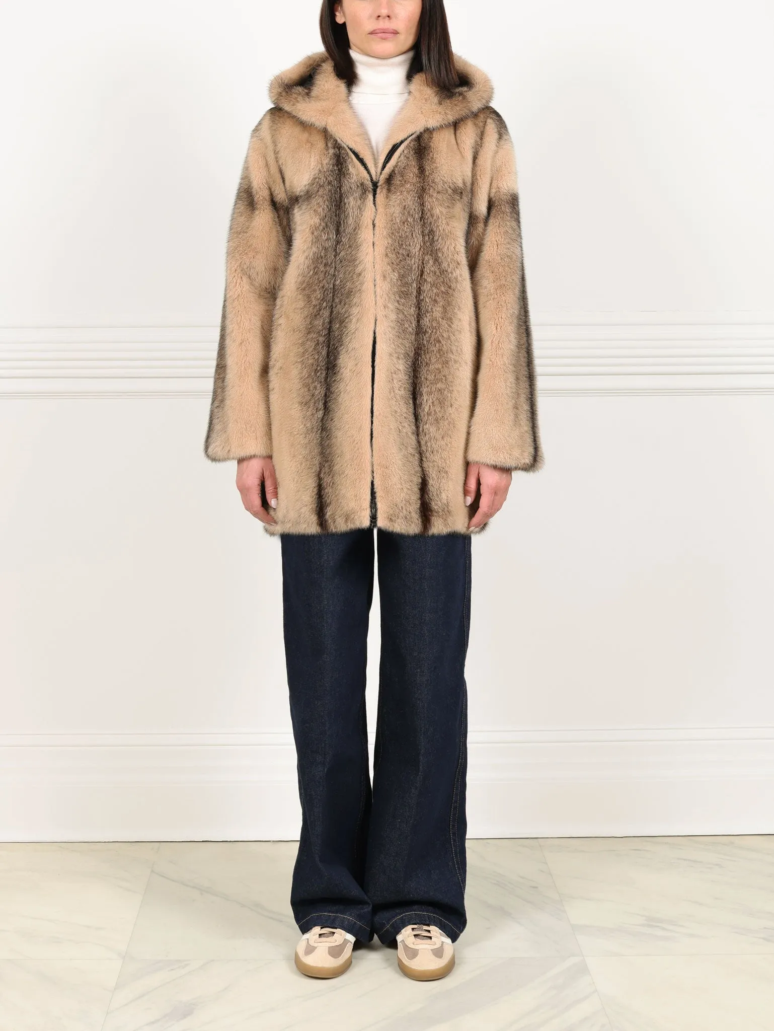 The Louisa Hooded Vertical Mink Fur Jacket sold by Pologeorgis