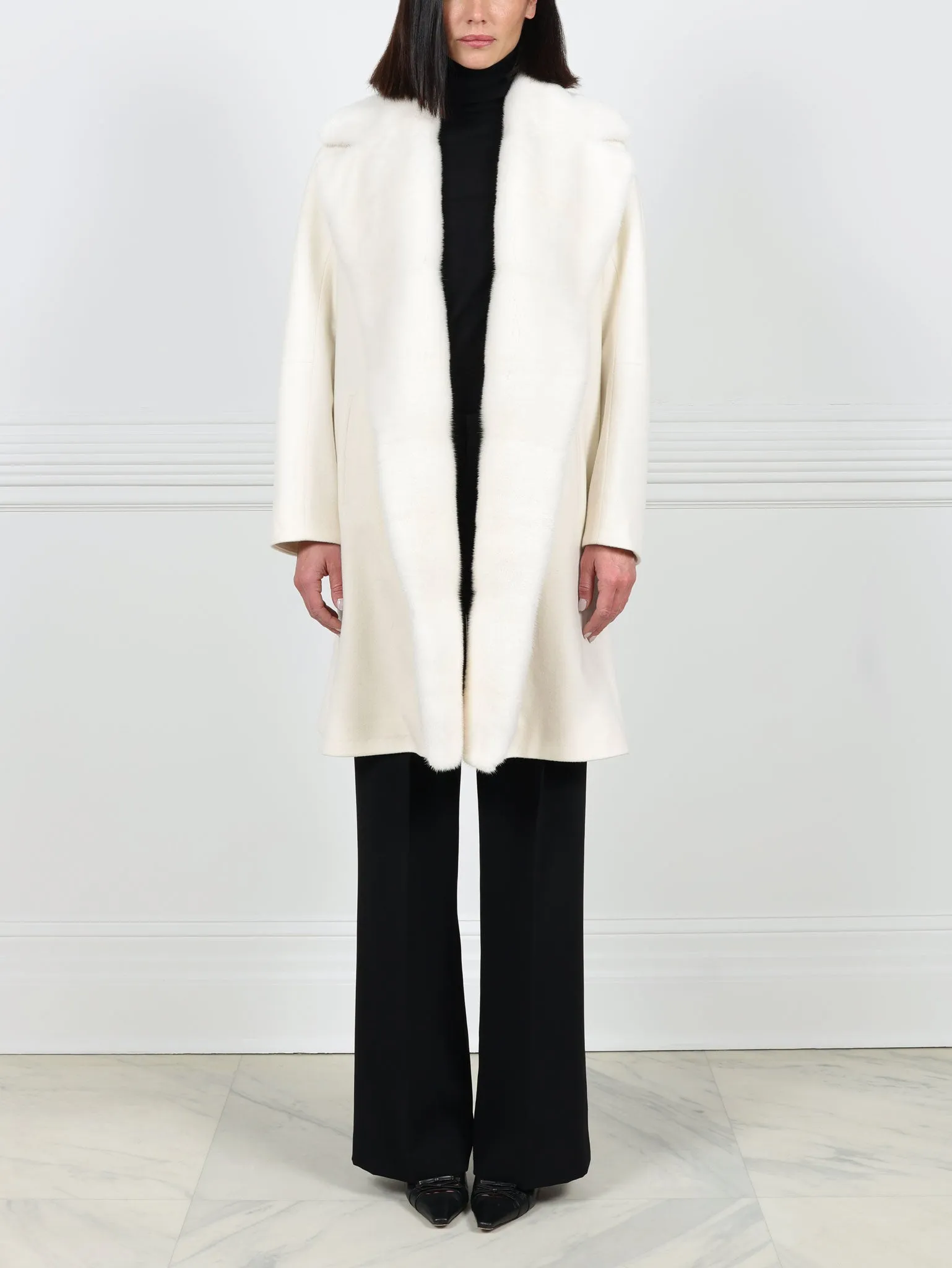 The Clutch Coat with Mink Fur sold by Pologeorgis