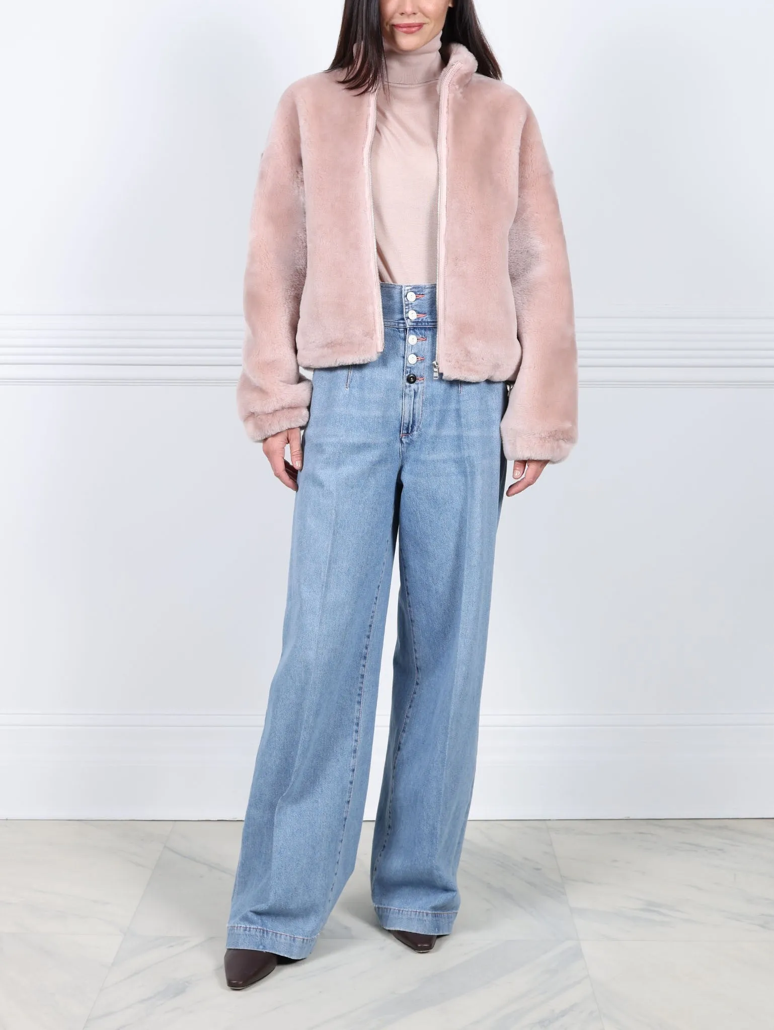 The Minnie Shearling Bomber Jacket sold by Pologeorgis