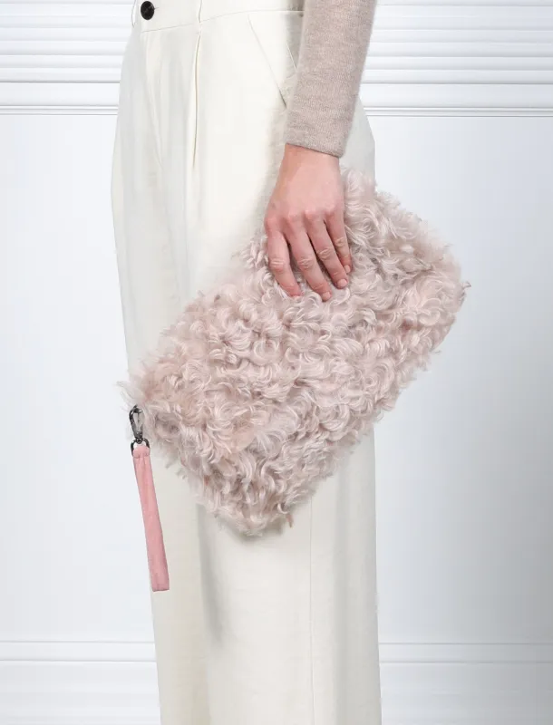 Curly Shearling clutch sold by Pologeorgis