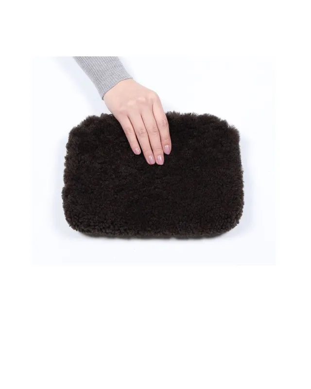 Curly Shearling Zip Clutch sold by Pologeorgis