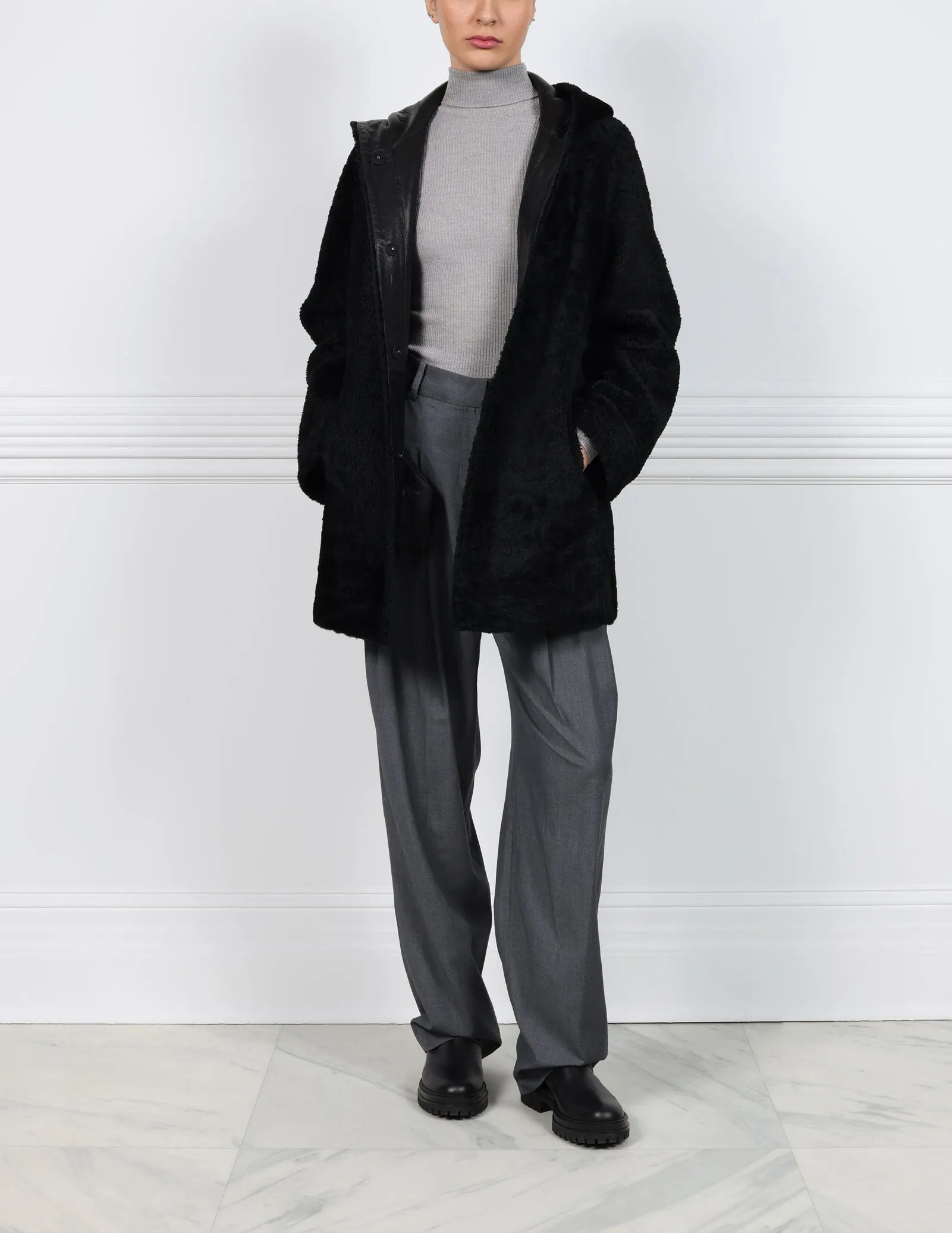 The Davie Hooded Curly Shearling Coat sold by Pologeorgis