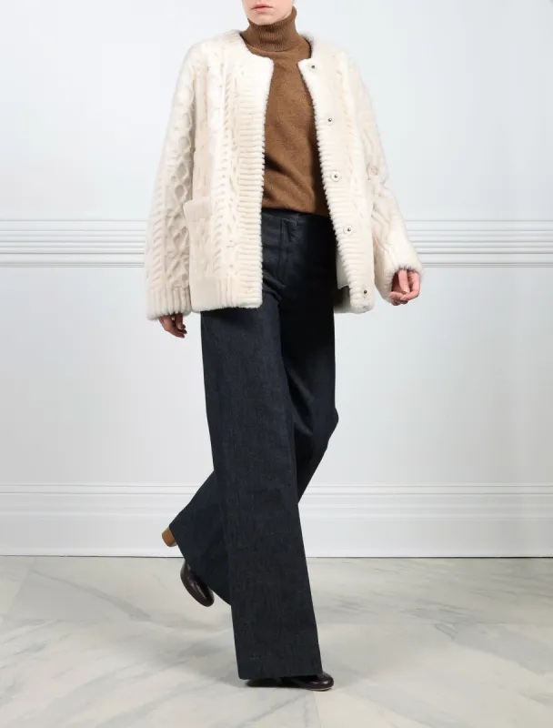 The Kelsey Cable Knit Grooved Shearling Jacket sold by Pologeorgis