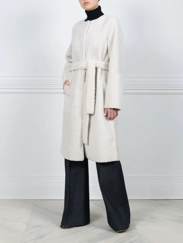 The Marilyn Reversible Shearling Coat sold by Pologeorgis