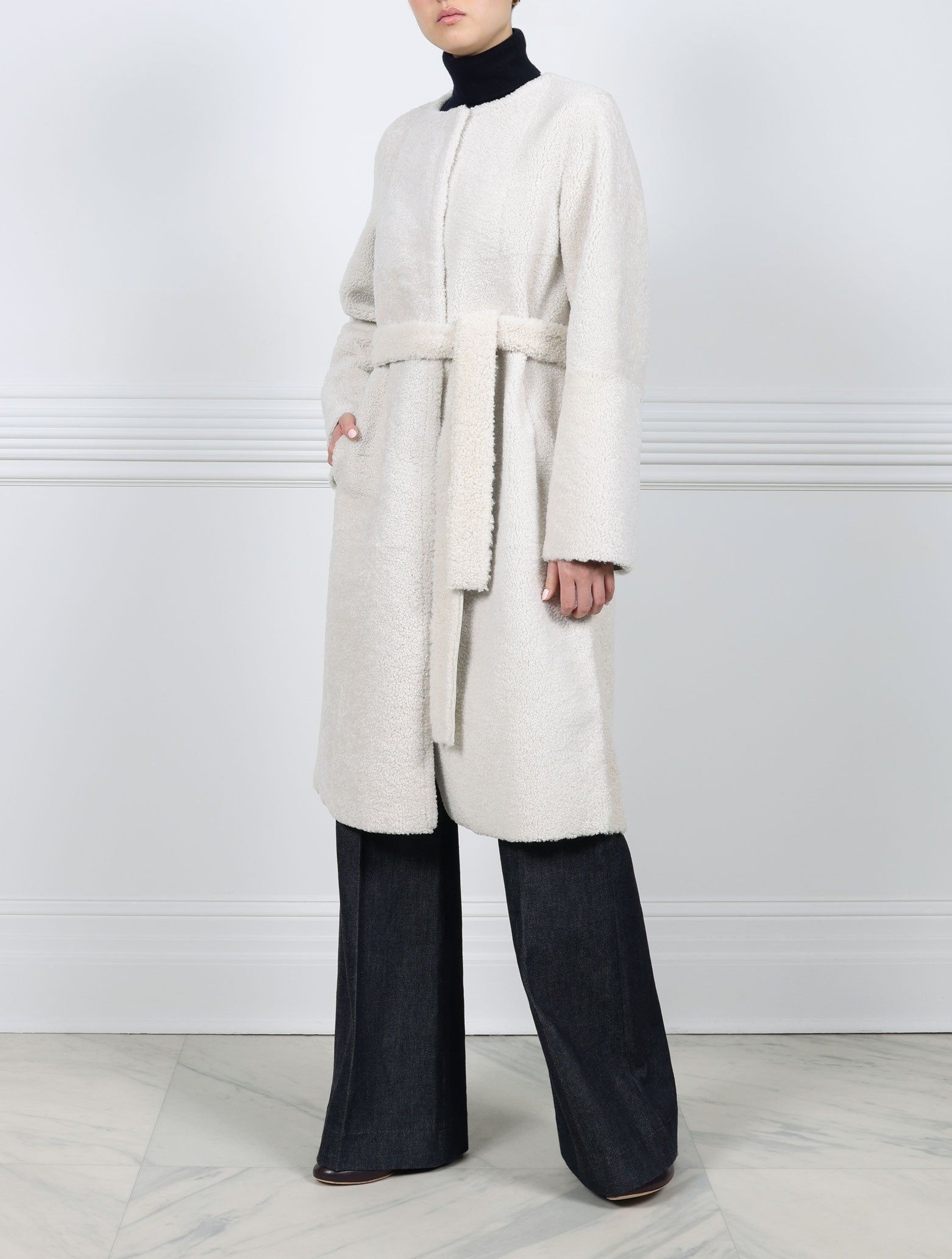 The Marilyn Long Reversible Shearling Coat sold by Pologeorgis