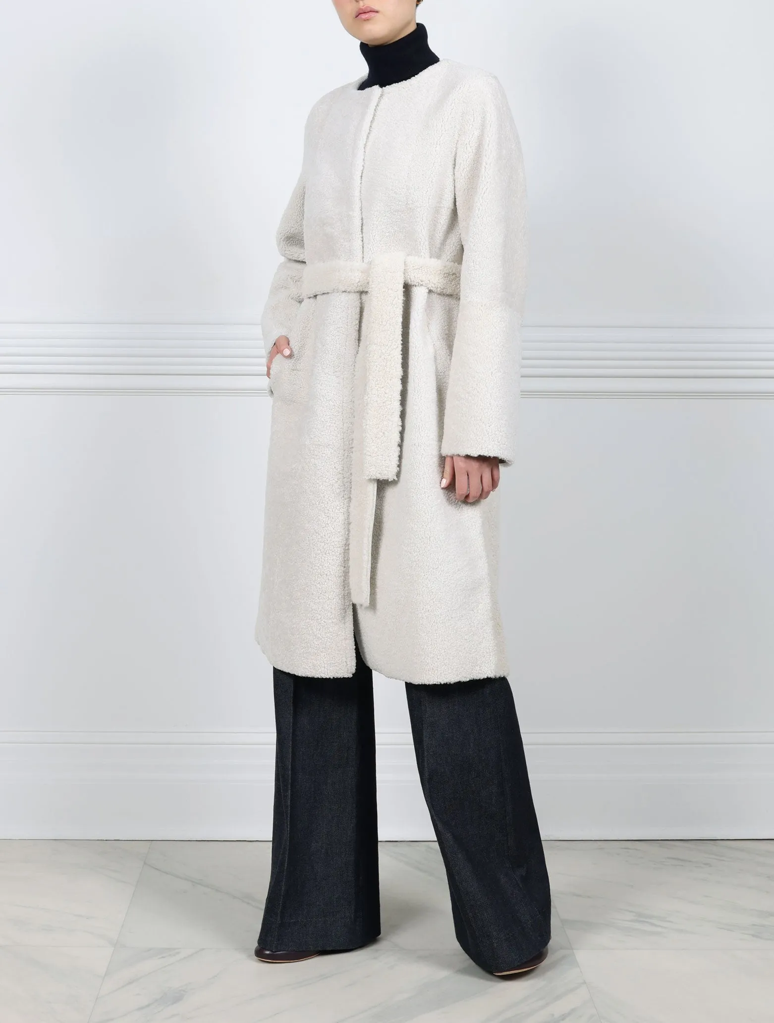 The Marilyn Reversible Shearling Coat sold by Pologeorgis