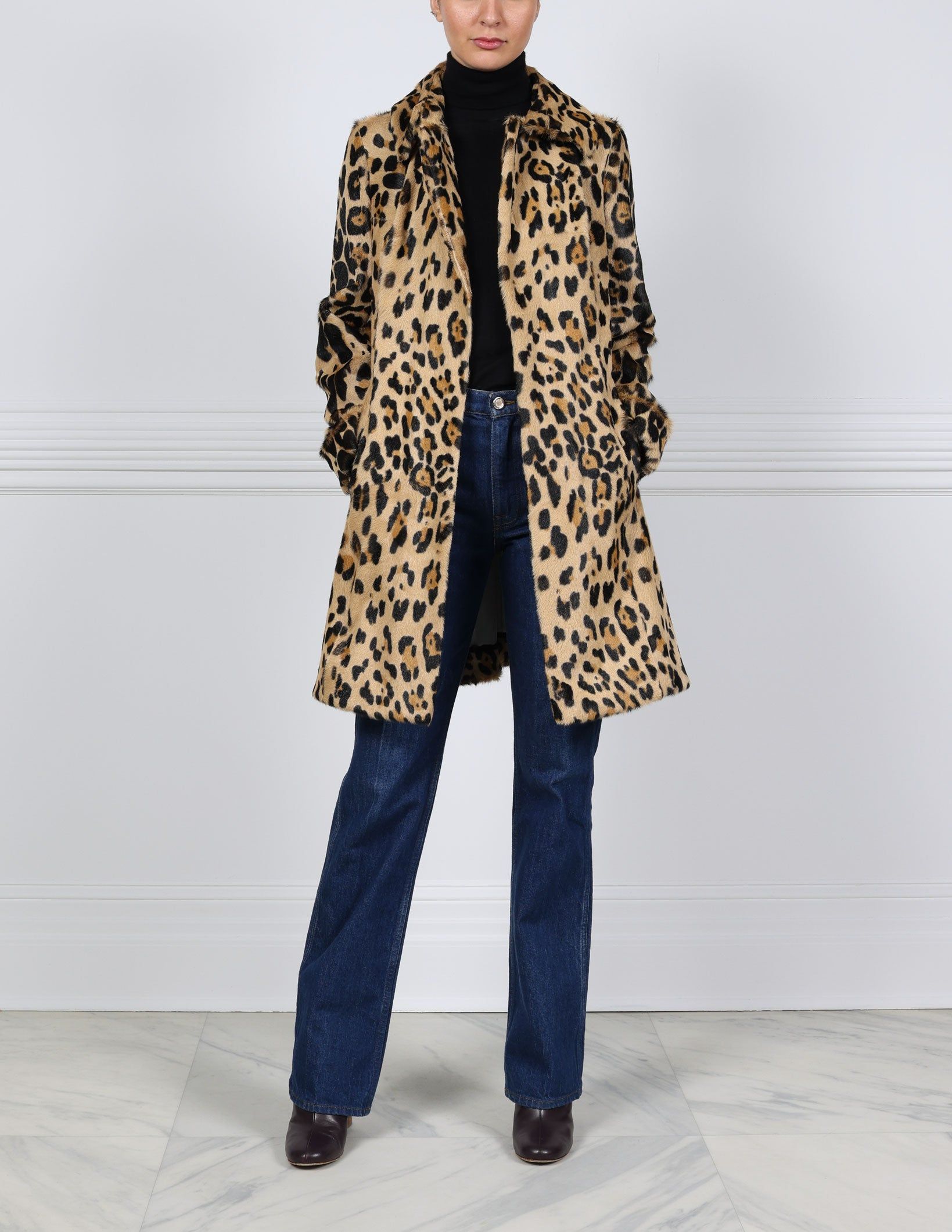 The Miggy Leopard Printed Shearling Coat sold by Pologeorgis