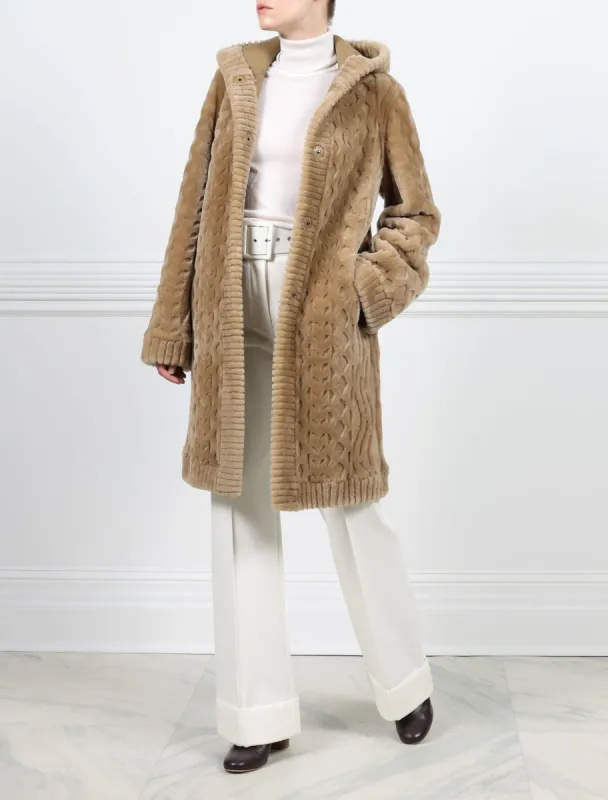 The Emily Cable Knit Grooved Shearling Coat sold by Pologeorgis