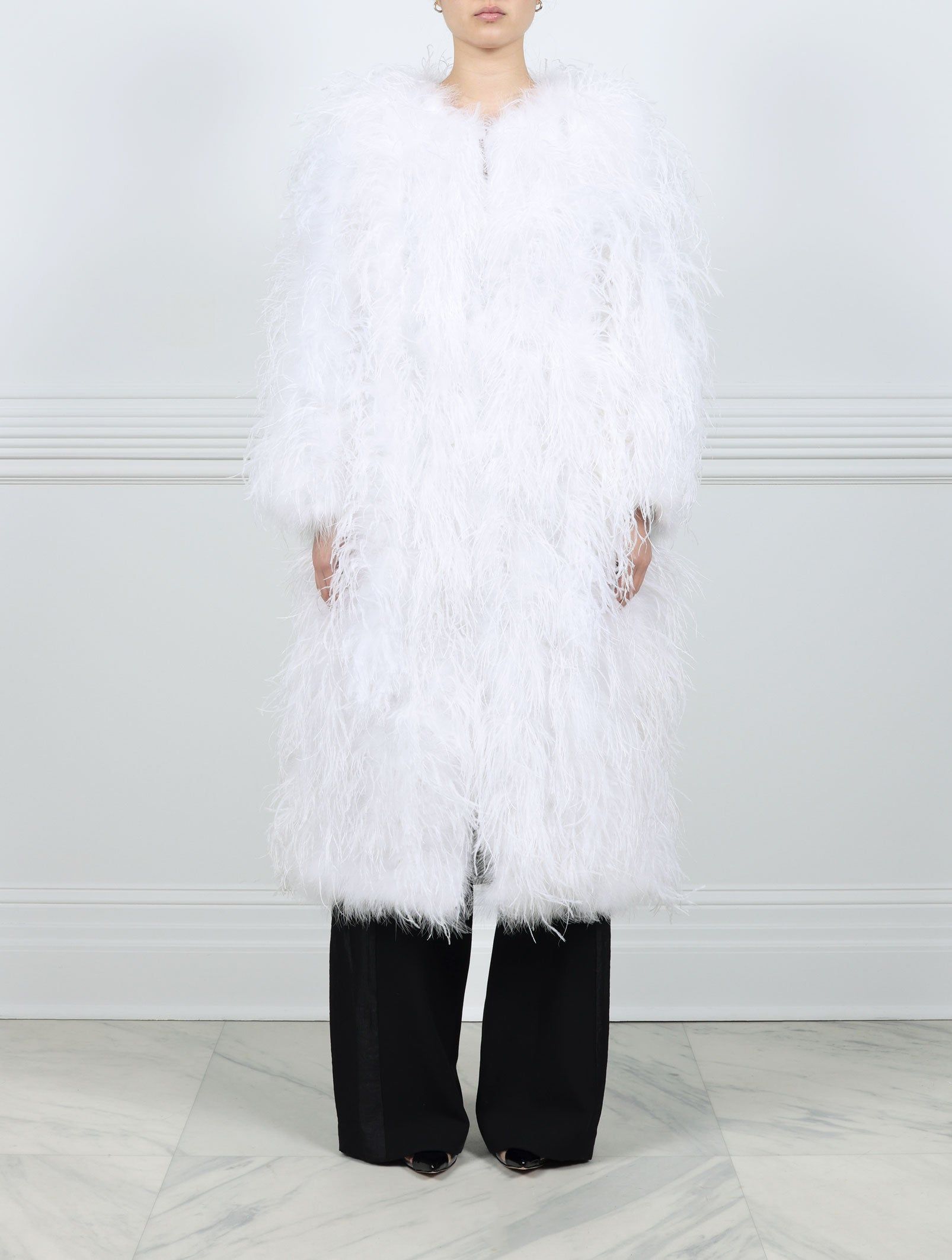 The Kallista Feather Coat available in Black and White sold by Pologeorgis