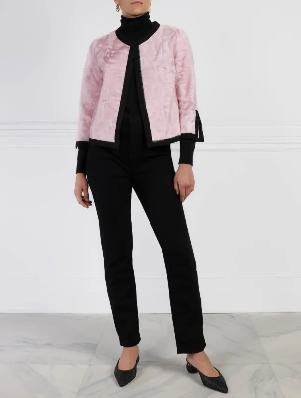The Pravita Silky Lamb Jacket with Black Trim in Pink sold by Pologeorgis