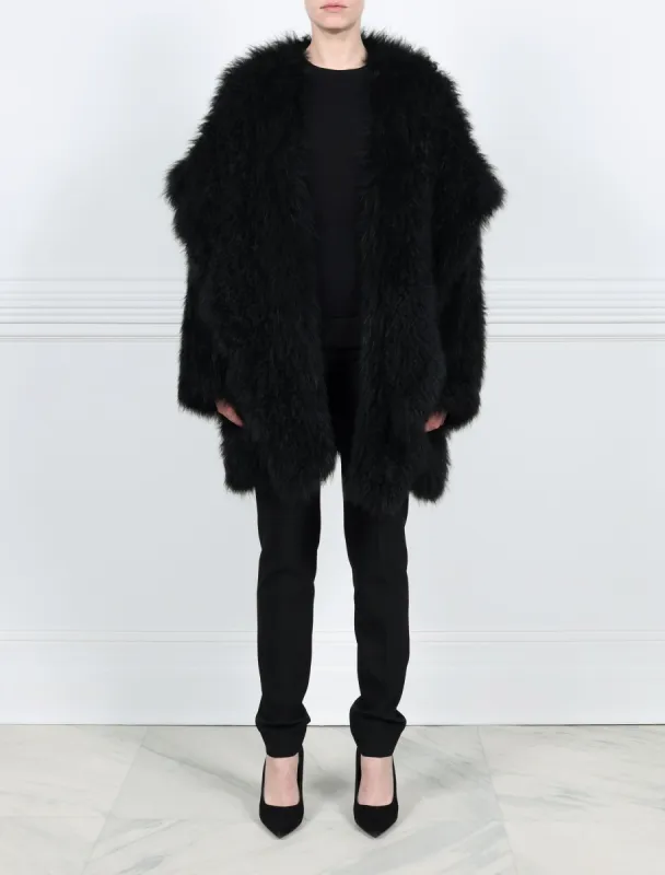 Oversized Hooded Knitted Shearling Coat in Black sold by Pologeorgis