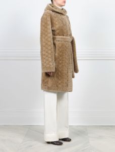 The Emily Cable Knit Grooved Shearling Coat sold by Pologeorgis