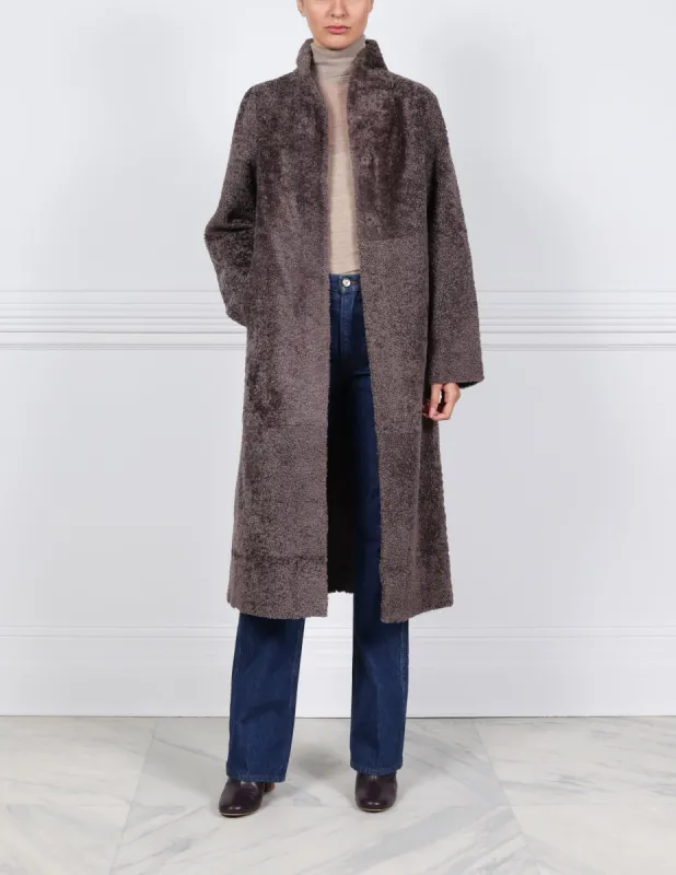 The Cleo Reversible Curly Shearling Coat sold by Pologeorgis