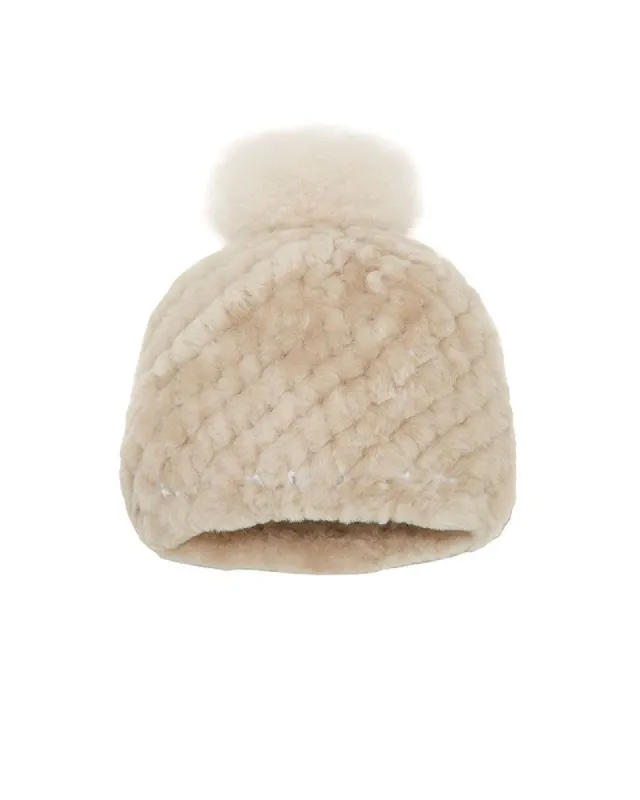 The Knit Shearling Hat with Pom in Multiple Colors sold by Pologeorgis