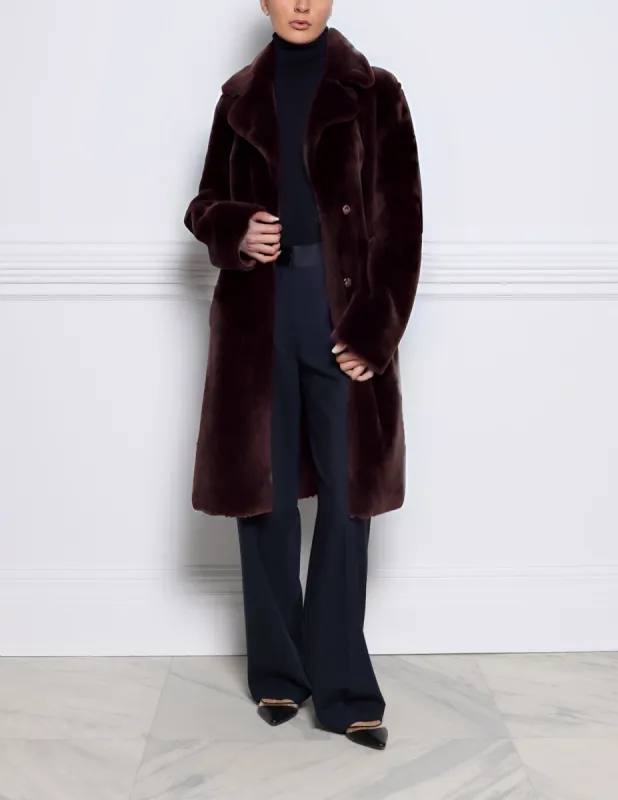 The Cali Shearling Wrap Coat sold by Pologeorgis