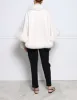 The Sol Cashmere Cape with Fox Trim sold by Pologeorgis