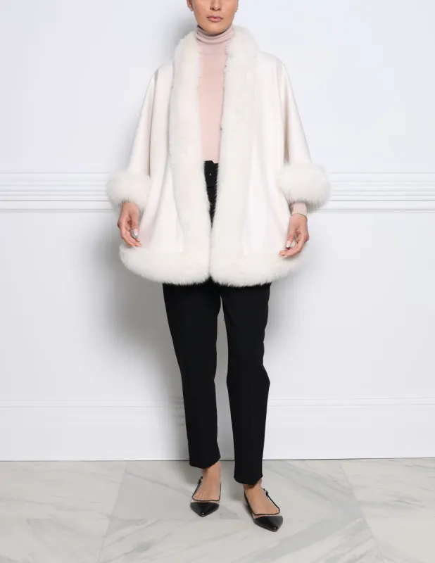 The Sol Cashmere Cape with Fox Trim sold by Pologeorgis