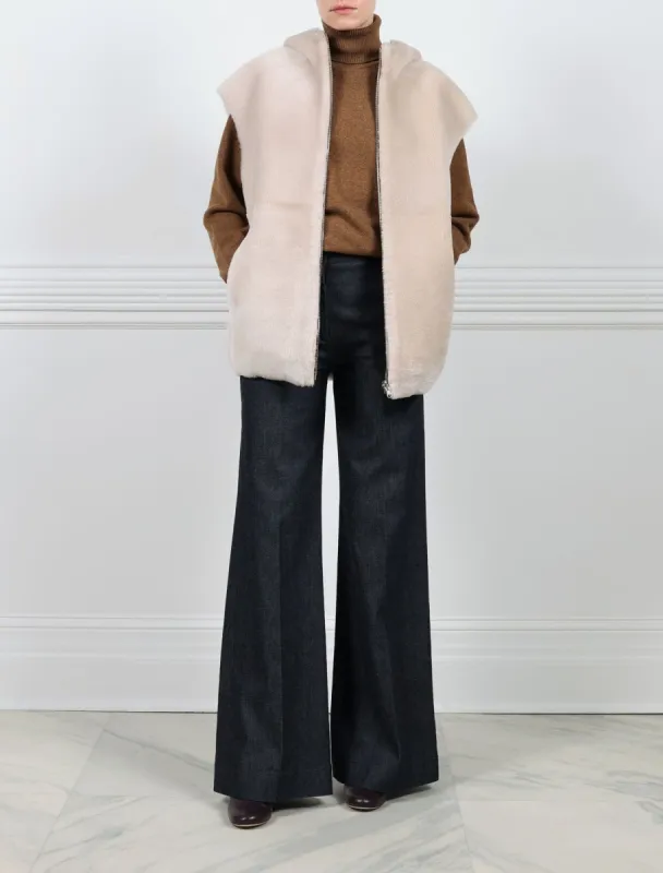 The Amelia Hooded Shearling Cap Sleeved Vest sold by Pologeorgis