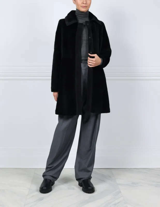 Suede Trimmed Shearling Coat in Black sold by Pologeorgis