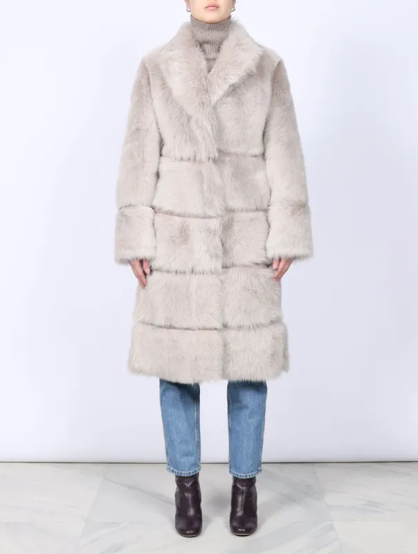 The Julia Toscana Shearling Coat sold by Pologeorgis