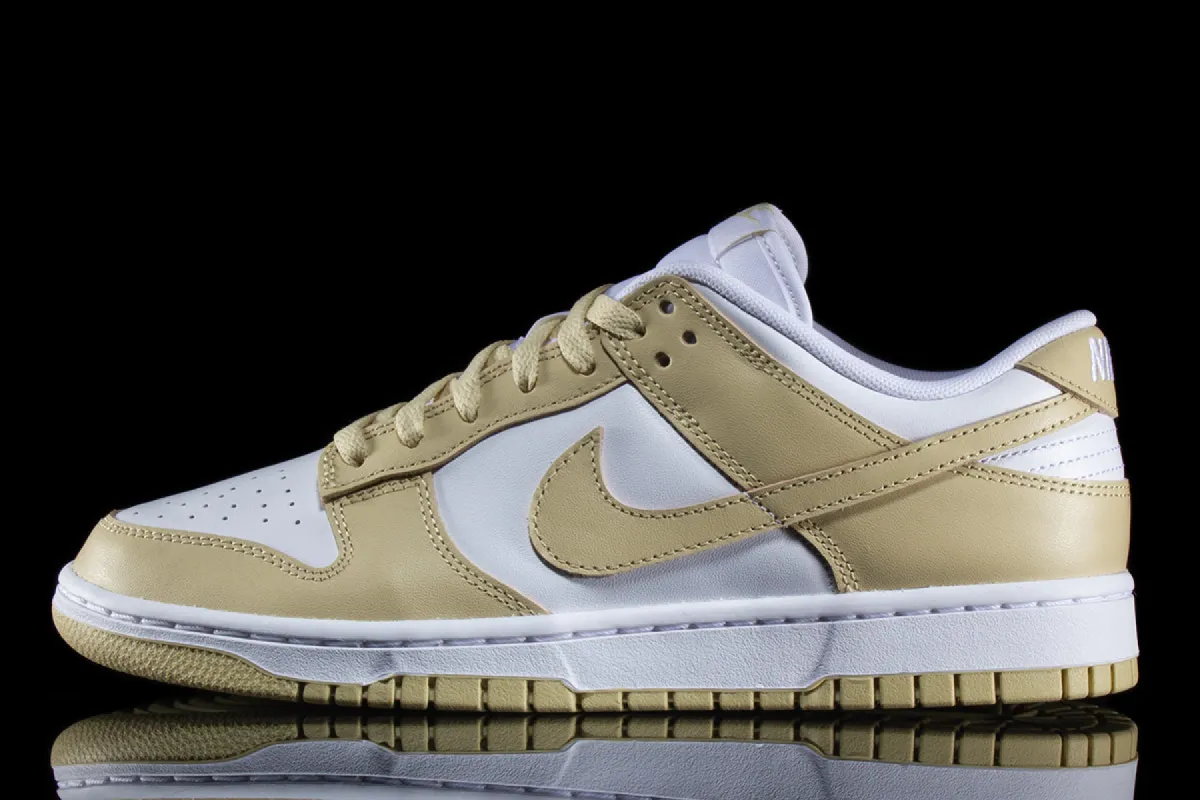 Dunk Low Retro "Team Gold" sold by Premier