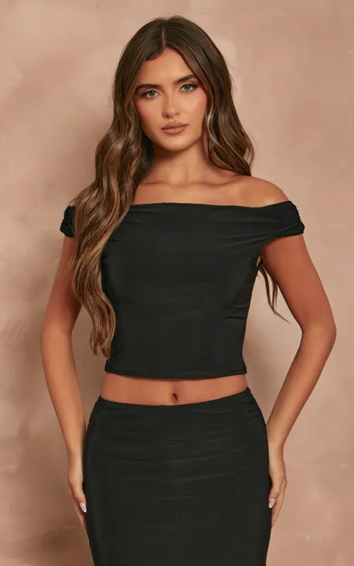Black Slinky Slash Neck Off The Shoulder Top sold by Pretty Little Thing