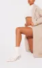 Cream Wide Fit Faux Leather Point Toe Buckle Detail Tab Ankle Heeled Boots sold by Pretty Little Thing