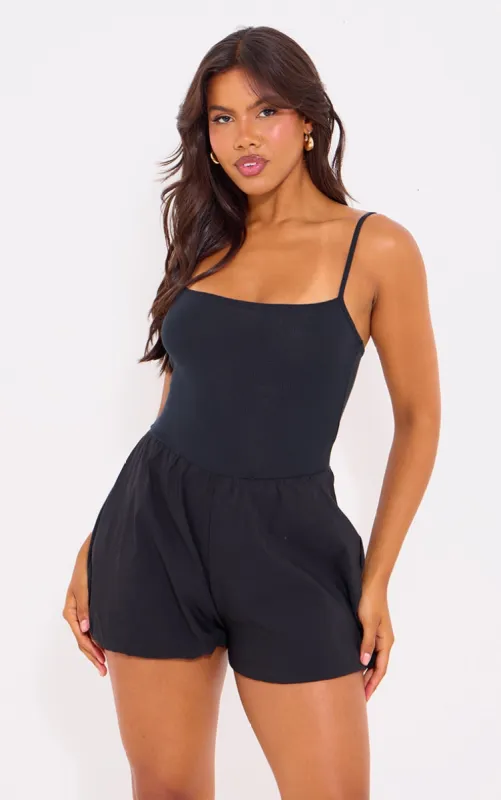 Black Rib Contrast Puff Short Playsuit sold by Pretty Little Thing