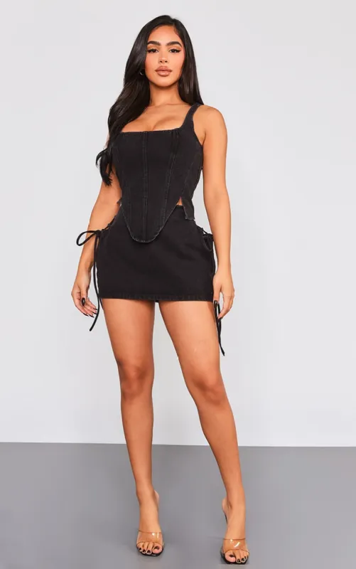 Petite Washed Black Denim Lace Up Mini Skirt sold by Pretty Little Thing