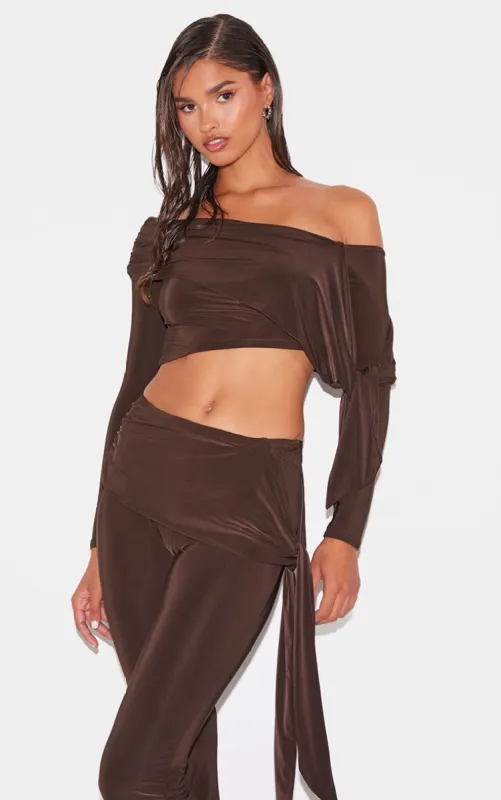 Chocolate Slinky Ruched Off The Shoulder Long Sleeve Top sold by Pretty Little Thing