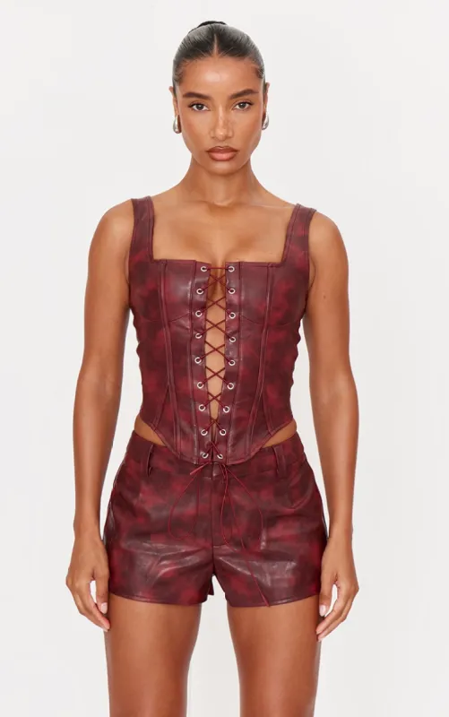 Burgundy Washed Faux Leather Lace Up Corset sold by Pretty Little Thing